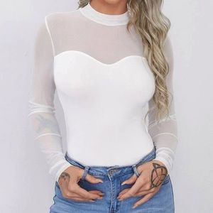 Long sleeve white top.